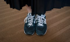 Yumi Ishikawa, a 32-year-old actress and writer, wears a pair of blue New Balance sneakers while posing for photos Wednesday, June 5, 2019, in Tokyo. As the world enters the #MeToo era, Japanese women are saying, "No," to high heels in the rising #KuToo movement, a play on the words for "shoes" and "agony." Ishikawa, who started the movement, handed the labor ministry a petition in protest this week. (AP Photo/Jae C. Hong)