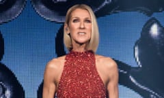 Blond woman in red sparkly dress in front of blue screen