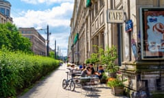 People sitting outside Ministry of Coffee cafe, Warsaw, Poland