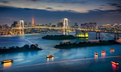 Tokyo Bay with Tokyo Tower<br>View of the downtown buildings and bridges of Tokyo Bay at dusk.