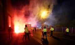 Police attempt to put out flares that have thrown towards them outside Villa Park before the Europa Conference League game on Thursday