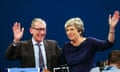 Theresa May and husband Philip wave to the crowd after her speech at the Conservative conference
