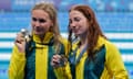 Mollie O’Callaghan (right) and Ariarne Titmus with their gold and silver 200m freestyle medals.