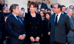 Nicolas Sarkozy, left, his wife, Carla Bruni, and François Hollande attend the national homage to the singer Charles Aznavour in Paris in October 2018.