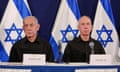 Israeli prime minister Benjamin Netanyahu (left) and defence minister Yoav Gallant (right) at a press conference with Israeli flags behind them