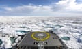 A ship surrounded by a vast sea of ice.