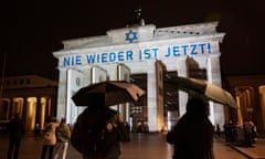 The slogan ‘Nie Wieder Ist Jetzt!’ (‘Never again is now’) is projected onto the Brandenburg Gate in Berlin to mark the 85th anniversary of the November 1938 pogroms in Germany and Austria