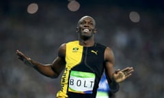 Usain Bolt celebrates as he crosses the line to win the 100m final.