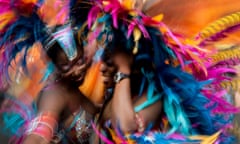 Dancers make their way along Westbourne Grove during the Notting Hill Carnival