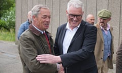 Reform UK leader Nigel Farage (left) shakes hands with Lee Anderson, Reform UK parliamentary candidate for Ashfield, Nottinghamshire.