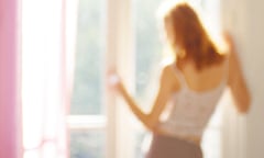 Woman looking out of window, blurred