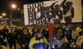 A protestor demonstrates in front of a line of police officers in solidarity with protests over the Baltimore death of Freddie Gray, in Chicago, Illinois, April 28, 2015. Gray, a 25-year-old black man, died in Baltimore police custody on April 19. REUTERS/Jim Young