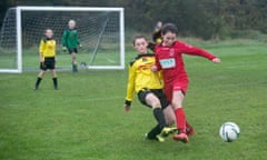 Girls playing football