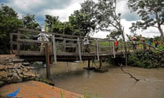 Refugees from South Sudan cross a bridge over the Kaya river in Koboko district in 2017Refugees from South Sudan cross a bridge over the Kaya river in Koboko district in 2017