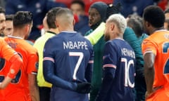 Champions League - Group H - Paris St Germain v Istanbul Basaksehir F.K.<br>Soccer Football - Champions League - Group H - Paris St Germain v Istanbul Basaksehir F.K. - Parc des Princes, Paris, France - December 8, 2020 Referee Ovidiu Hategan with Istanbul Basaksehir’s Demba Ba as the match is interrupted REUTERS/Charles Platiau TPX IMAGES OF THE DAY
