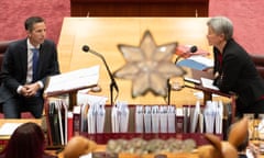 Penny Wong exchanges words with Simon Birmingham after question time in the Senate