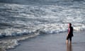 A Moroccan woman wearing a "burkini", a full-body swimsuit designed for Muslim women, enters the sea at Oued Charrat beach, near the capital Rabat, on August 17, 2016. / AFP PHOTO / FADEL SENNAFADEL SENNA/AFP/Getty Images