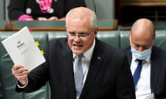 Scott Morrison holding a copy of the budget in the House of Representatives