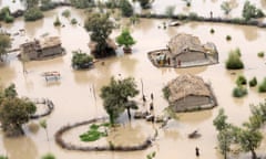 Residents in a flood-affected area on the outskirts of Sukkur in Pakistan