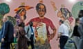 Cop27 participants walk past a climate mural in the conference’s Youth and Children Pavilion in Sharm el-Sheikh, Egypt.