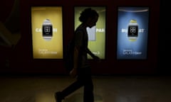 A man walks past a Samsung billboard at Kuala Lumpur convention centre in Malaysia