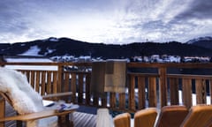 Two wooden chairs on the terrace of Chalet de Soie, overlooking the mountains at Morzine, France.