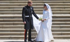 Prince Harry on his wedding day with Meghan Markle in a dress designed by Clare Waight Keller.