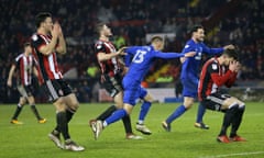 Anthony Pilkington celebrates as Sheffield United players react to his late equaliser.