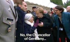 Angela Merkel with a woman at an armistice event