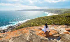 A woman enjoys the scenery from Remarkable Rocks, Kangaroo Island, South Australia