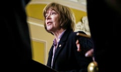 a woman speaks from behind a lectern