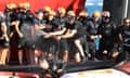 Team New Zealand crew members celebrate their victory over Luna Rossa in the 36th America’s Cup