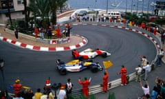 Marshals and fans salute race winner Ayrton Senna, McLaren MP4-7A Honda, and second positioned Nigel Mansell, Williams FW14B Renault, on the slowing down lap during the 1992 Monaco Grand Prix.