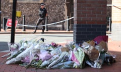 Flowers placed in Reading town centre, the scene of a multiple stabbing attack which took place on Saturday, leaving three people dead and another three seriously injured