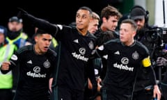 Celtic's new signing Adam Idah (centre) celebrates after scoring the winning penalty at Easter Road.