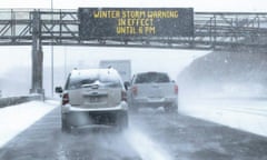 A sign warning of snow and ice conditions is seen in St Paul, Minnesota.