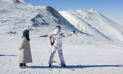 A man with his mother on the slopes in Tochal, Alborz Mountains, North of Tehran