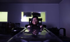 Jennifer Wong in a race-car simulator looking bemused