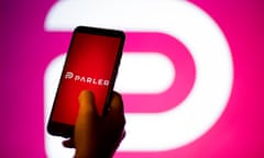 Parler app photo illustrations<br>Mandatory Credit: Photo by Thiago Prudencio/SOPA Images/REX/Shutterstock (11709581c) In this photo illustration a Parler App and logo is seen displayed on a smartphone and in the background. The ‘free speech’ social media platform, Parler, a hit with Trump supporters and an alternative to Twitter, stops working after losing support from Amazon, Apple and Google Parler app photo illustrations