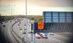 A Just Stop Oil protest on an overhead gantry of the M25 near London in November 2022.