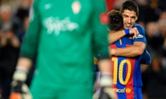 Barcelona’s Luis Suarez, right, celebrates with Lionel Messi after scoring.