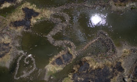 The Barwon River in February 2018, showing the famous Indigenous fish traps below the weir at Brewarrina, NSW.