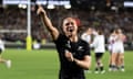 Ruby Tui points and shouts jubilantly as England players console each other in the background