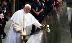 Pope Francis places a white rose on the names of the September 11 terrorist attacks victims at the edge of the South Pool  of the 9/11 memorial in New York on September 25, 2015. Pope Francis, who has built a wide global following for his reform-minded views, is on a five-day official visit to the US. AFP PHOTO/JEWEL SAMADJEWEL SAMAD/AFP/Getty Images