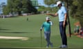 Sweden's Åberg lines up his putt on the green on the 10th hole as Matthieu Pavon of France looks on during the third round of the Masters