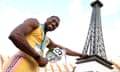  Noah Lyles poses with a miniature Eiffel Tower after winning the men's 200 meter final at the US Olympic Team Track &amp; Field Trials. 