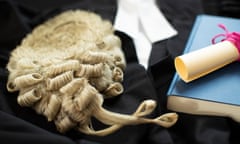 A barrister's wig with gown and legal brief