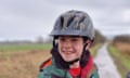 Oran smiling, wearing a mud-covered helmet.