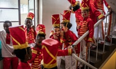 Students of the Dance Centre Kenya (DCK) react while waiting to take the stage during the production of the 'Nutcracker', a classical ballet traditionally performed in the Christmas period, at the Kenya National Theatre in Nairobi on November 26