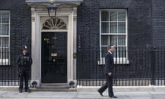 David Cameron walking outside 10 Downing Street